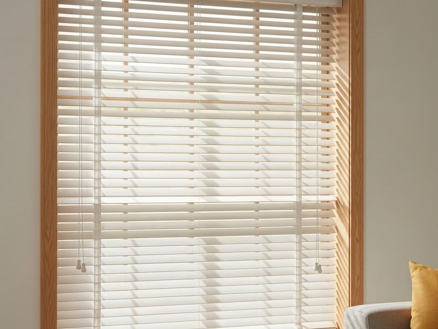 Approved faux wood blinds in a durable light finish